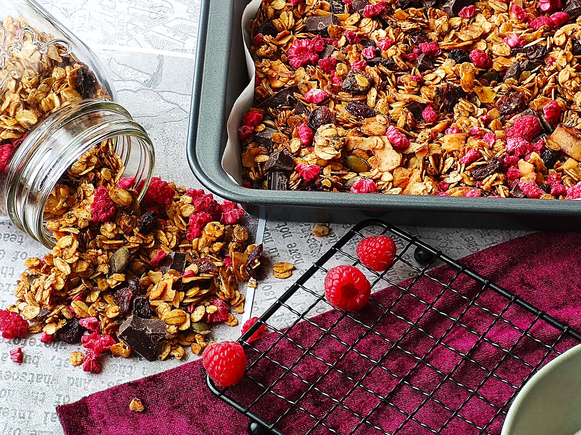 Homemade granola with raspberry and dark chocolate chunk