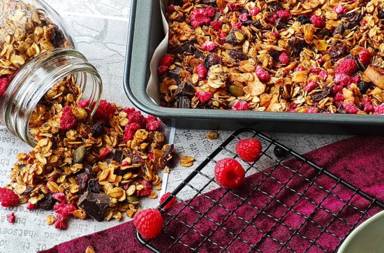 Homemade granola with raspberry and dark chocolate chunk